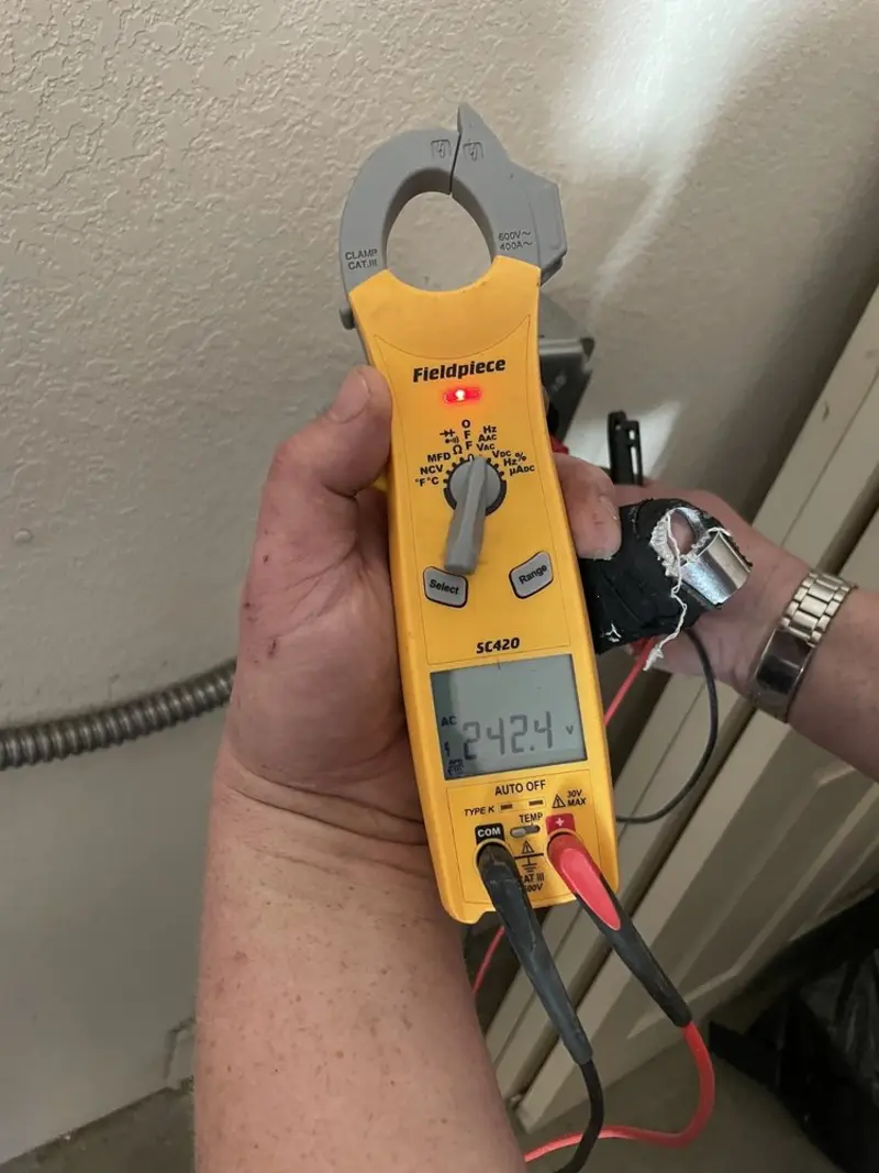 Voltage testing with clamp meter during Outlet Installation in Vestal